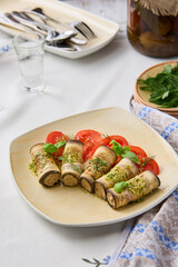 Elegant Eggplant Cheese Rolls on Rustic Plate with Vibrant Seasonal Garnish in Soft Natural Lighting
