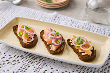 Gourmet Dark Rye Herring Toasts Rustic Elegance in Earthy Tones