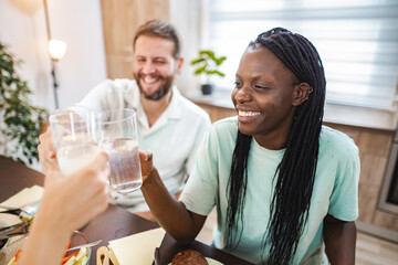 Celebrating friendship with cheers at a cozy dining table