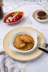 Golden Potato Pancakes on Rustic Table A Harmonious Blend of Textures and Warm Hues