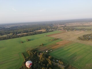 view of the city from above while flying in a hot air balloon
