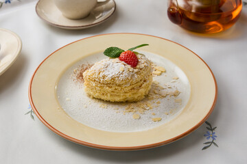 Delicate Napoleon Pastry on Elegant Table Setting with Soft Lighting