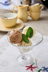 Elegant Scoop Artisanal Ice Cream in a Vintage Glass Dish with Mint Garnish