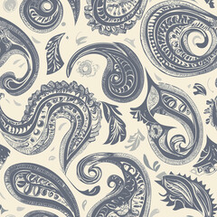 Intricate paisley pattern in shades of blue and cream, showcasing swirling designs and organic shapes on a light background.