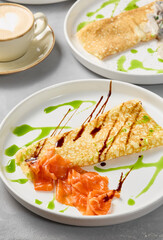 Elegant Salmon Omelette with Artistic Sauce Drizzle on White Plate