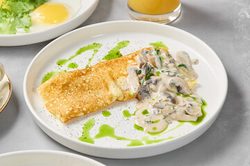 Gourmet Mushroom Omelette with Creamy Sauce on Elegant Plate – High Contrast Photography