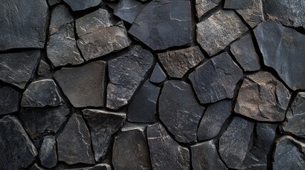 Fototapeta premium A high-contrast abstract background featuring dark stone patterns, ideal for industrial or minimalist themes.
