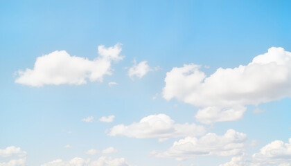 Fototapeta premium Serene fluffy clouds floating in clear blue sky, nature's beauty