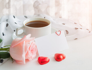 St Valentines day background - cup of coffee, rose, blank love card in pastel tones