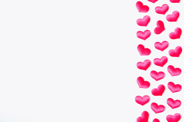 St Valentines day background. Pink textile hearts on the white wooden background, free space for text, Valentines day concept