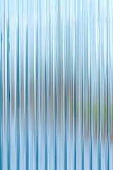 Obraz premium Abstract background with reeded ribbed glass effect texture 