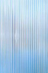 Obraz premium Abstract background with reeded ribbed glass effect texture 