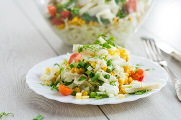 Chinese cabbage salad with squid, eggs, tomatoes and other vegetables