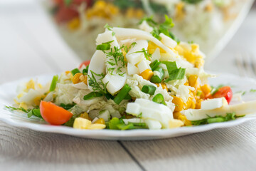 fresh salad with squid, eggs, tomatoes and other vegetables