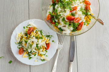 fresh salad with squid, eggs, tomatoes and other vegetables