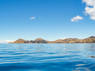 View of the Sun island in Titikaka lake bolivia from a boat