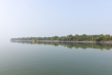 SUNDARBAN, INDIA-JANUARY 06: Tourists enjoying game drive on Safari boat at Sundarban Tiger Reserve, West Bengal, India on January 06, 2025