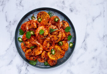 grilled shrimp, unpeeled, headless, with spices, on a marble table, homemade, no people,
