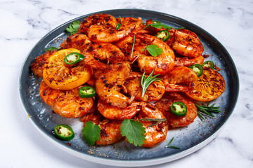 grilled shrimp, unpeeled, headless, with spices, on a marble table, homemade, no people,