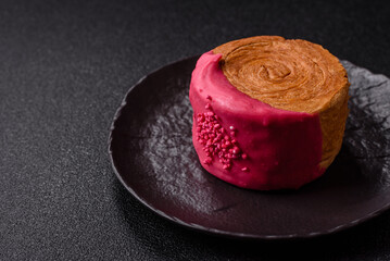 Round sweet New York roll croissant with raspberry cream filling