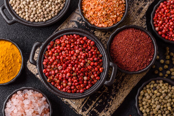 Variations of spices, allspice, turmeric, paprika, salt in ceramic bowls