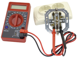 Digital multimeter and electric outlet isolated on white