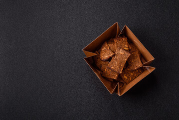 Crispy homemade brown bread chips with seeds and grains, salt, spices