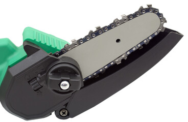 Close-up of a chain on the guide bar of a small wood electric ch