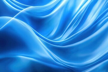 Fototapeta premium Blue fabric flowing in the wind creating abstract shapes on a blue background.