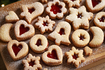 Traditonal homemade Linzer Christmas cookies filled with marmalade and dusted with sugar