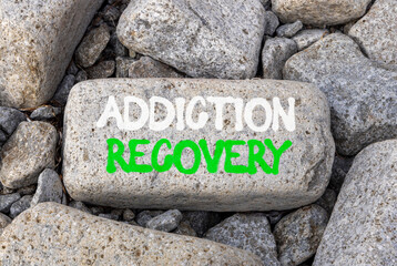 Addiction recovery symbol. Concept words Addiction recovery on beautiful big grey stone. Beautiful...