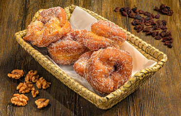 Golden sugar-coated donuts in a cozy setting
