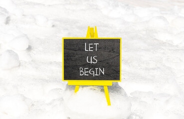 Let us begin symbol. Concept words Let us begin on beautiful black yellow blackboard. Beautiful...