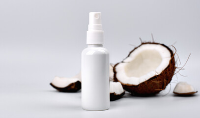 cosmetic cream and coconut on white background