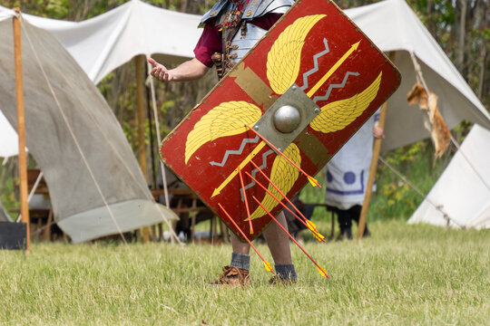 Roman legionary with shield pierced by arrows