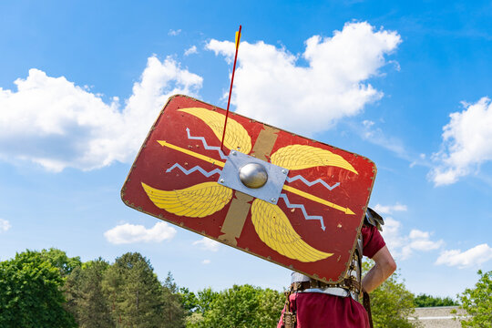 Roman legionary with shield pierced by arrows