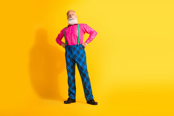 Full body photo of bearded gentleman confident pose wear fashionable clothes suspenders isolated on vibrant yellow color background