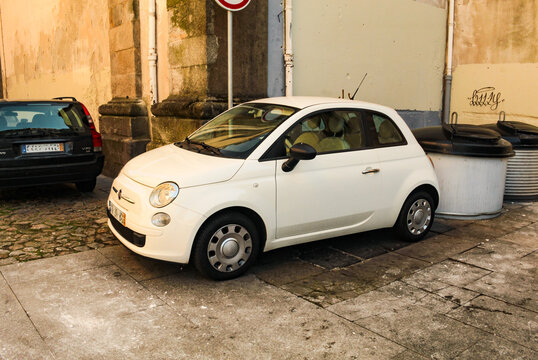 A small white car parked