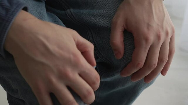 man with trembling legs.
A man has uncontrollable leg tremors due to severe stress.
The man experiences severe tremors in his legs.
Tremors, shaking, legs, knees, nerves