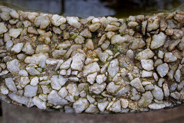 texture with small light pebbles close by
