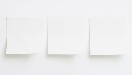 Three white sticky notes. Blank paper. Planning or reminder concept. Organization, reminder.