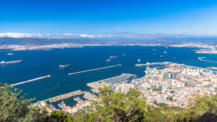 Gibraltar, British Overseas Territory and city on the Iberian Peninsula. Coastal city harbor view...