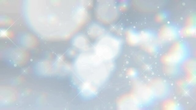 シルバー系のキラキラ素材が下から上に漂うようにゆっくり移動する