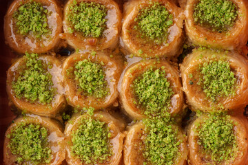 Delightful layers of dessert featuring pistachio and honey in a traditional sweet treat served in a festive setting