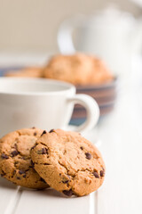 Chocolate chip cookies on white table.