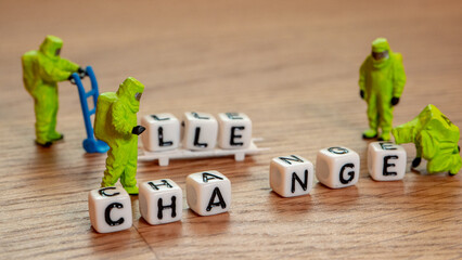 Removing white cubes with letters l and e of the word challenge creating new word change on wooden...