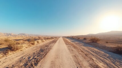 Desert Road Leading Towards Distant Mountains