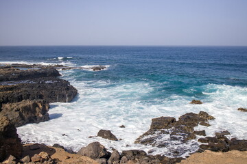 Waves crashing against a rocky shoreline in Gran Canaria.