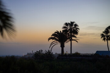 Obraz premium Faro de Maspalomas, Maspalomas Lighthouse in Gran Canaria at dusk or dawn.