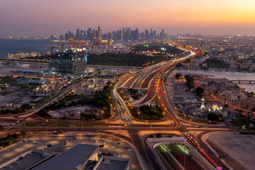 Fototapeta premium Aerial View of Doha Skyline from Lusail. Katara Lusail express way